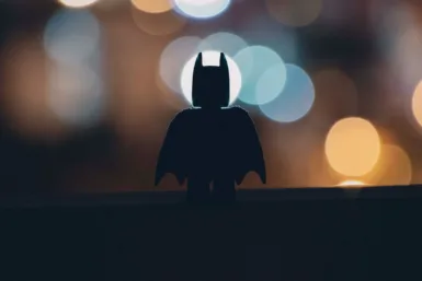 silhouette of person standing on the road during night time