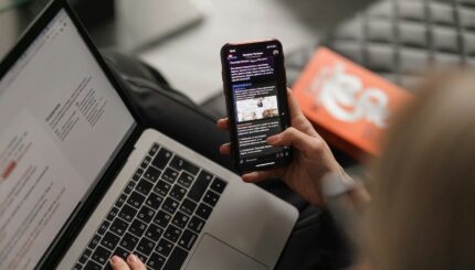 person holding black iphone 4
