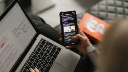person holding black iphone 4