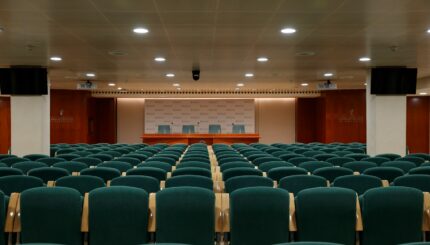 black chairs inside white room